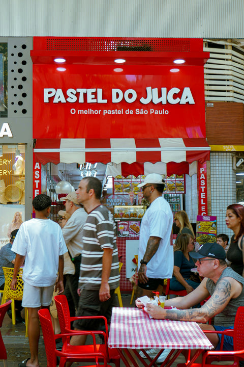 People gathered outside a pastel shop in são paulo