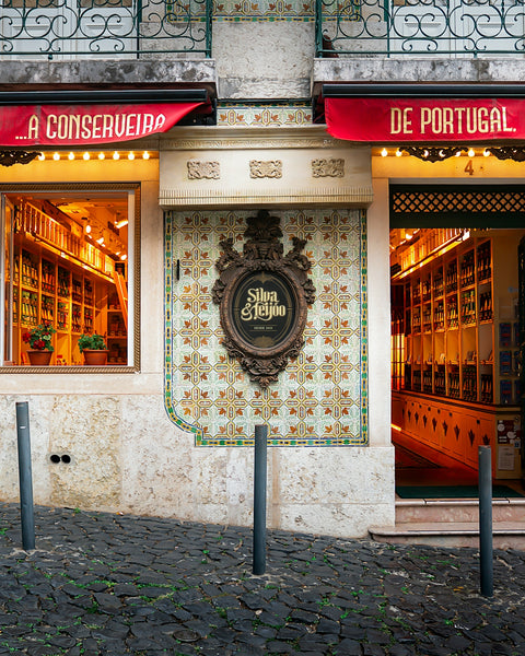 Ornate storefront with tiled facade and glowing interior